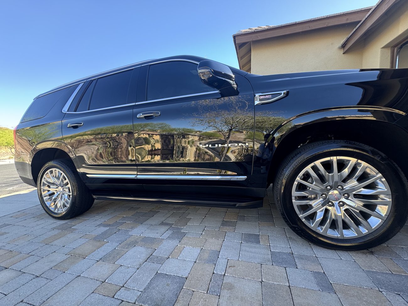 Detailed black Cadillac Escalade with a deep, clean shine