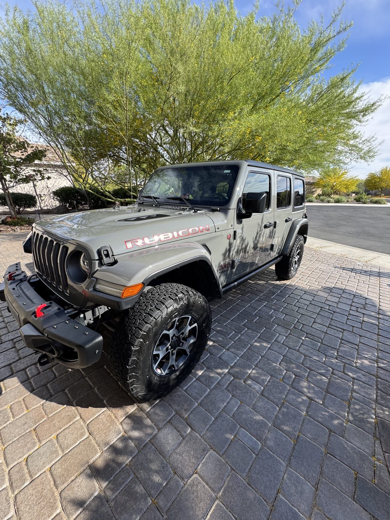 Detailed Jeep Wrangler Rubicon on a paver driveway