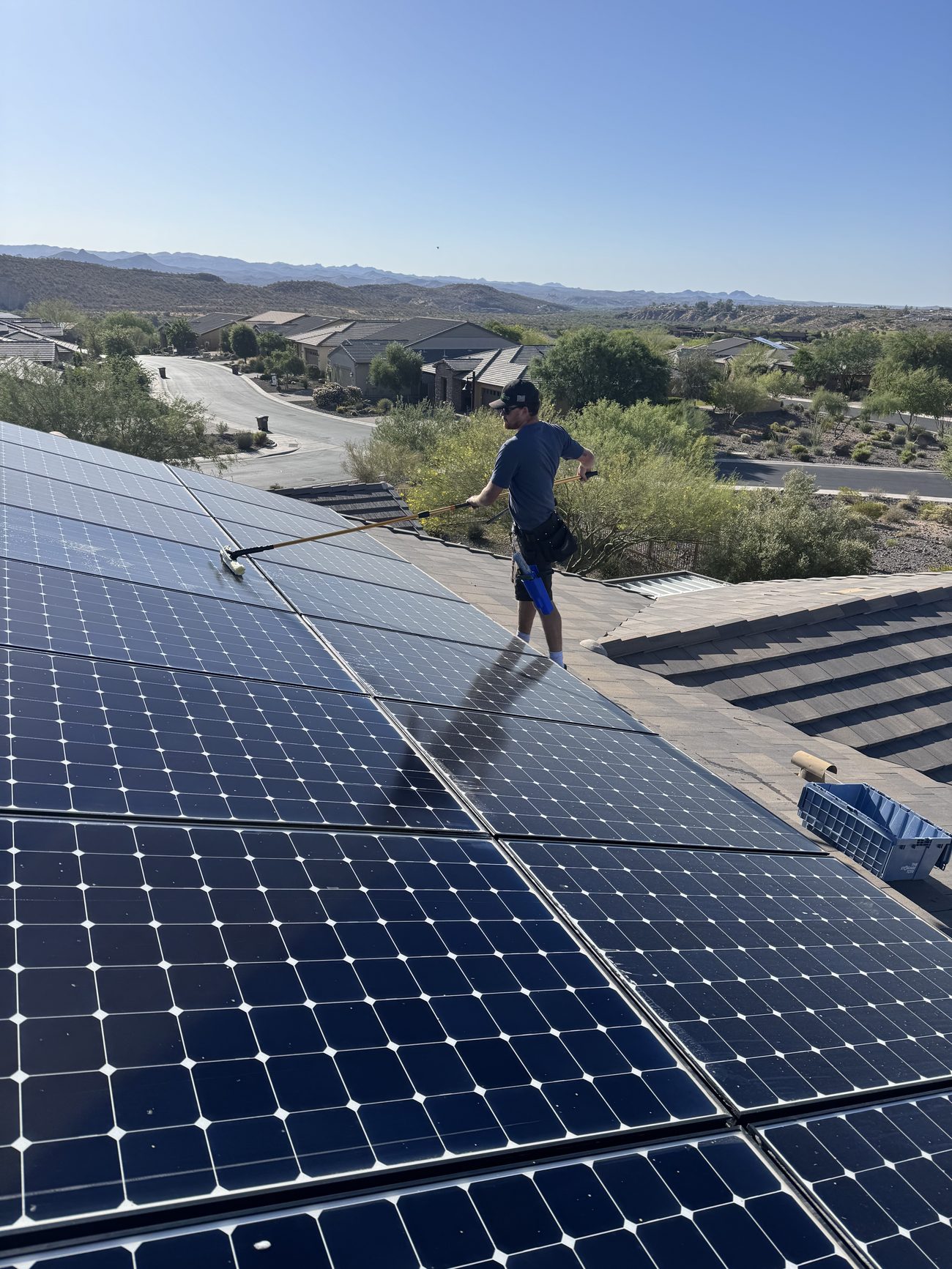 Freshly cleaned rooftop solar array overlooking the desert