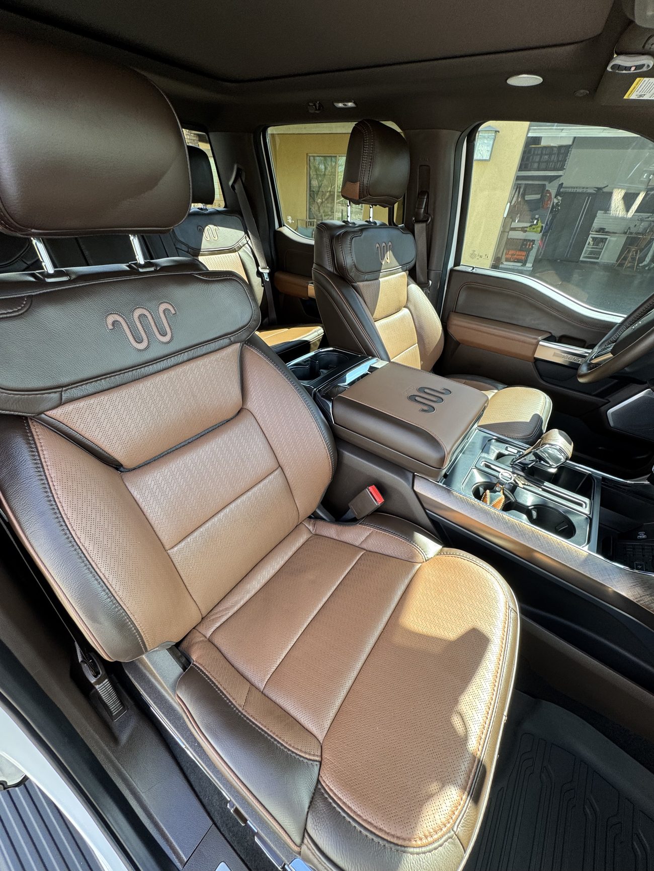 Conditioned tan leather truck interior after a full detail