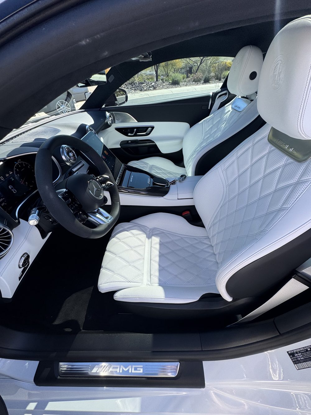Immaculately detailed white quilted-leather car interior